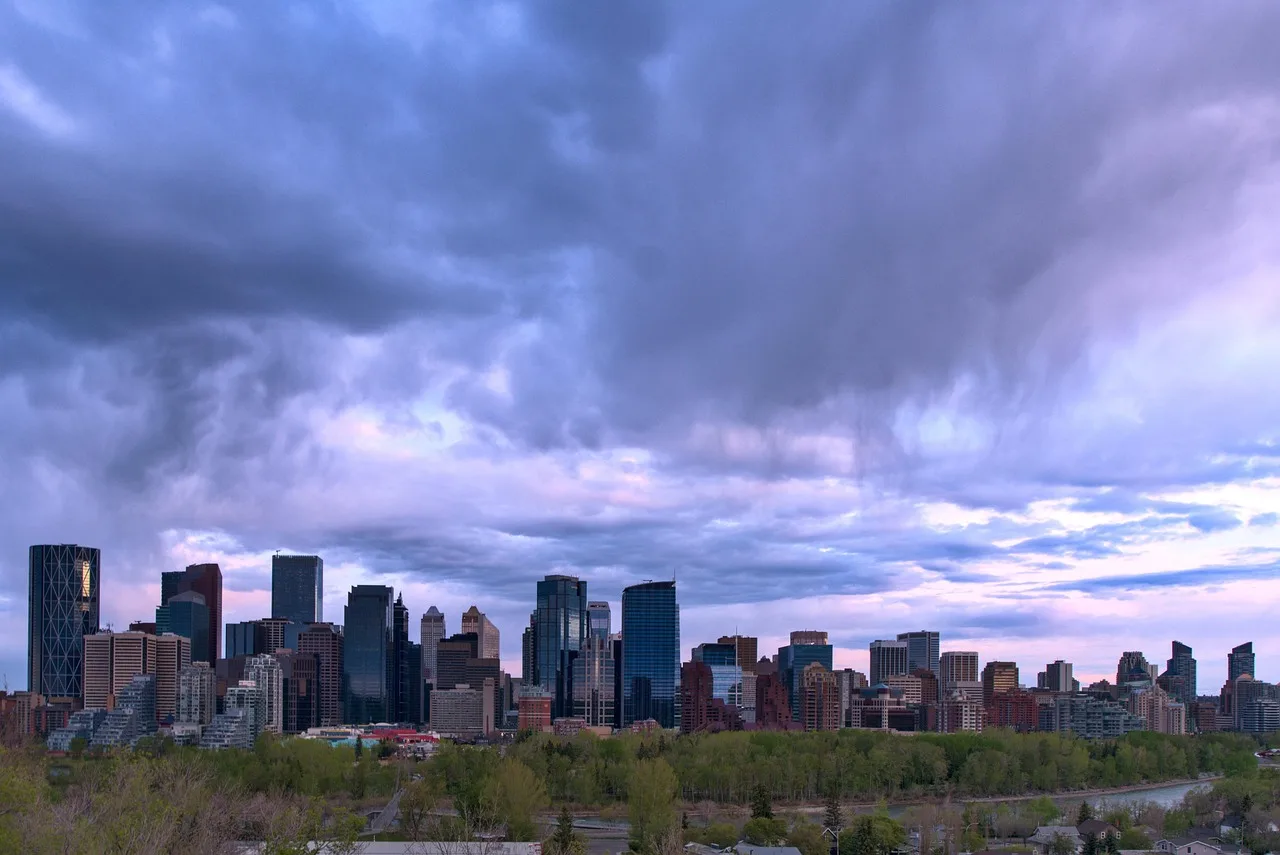 calgary, skyline, storm clouds, overcast, cloudy day, sunset, cityscape, river, architecture, buildings, nature, urban. A Calgary and Edmonton retention guide for premium retail