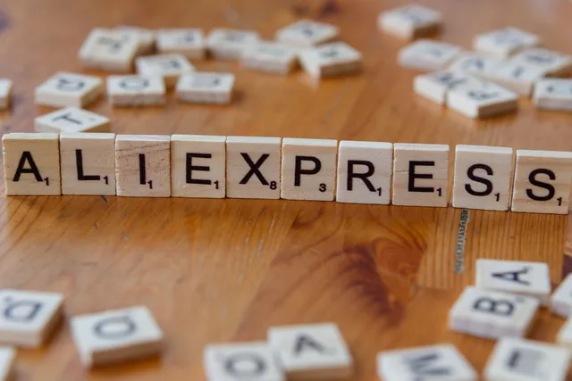 Close-up of Scrabble tiles forming AliExpress on a wooden surface, ideal for ecommerce and retail themes. Ecommerce marketing strategy: a working plan and checklist