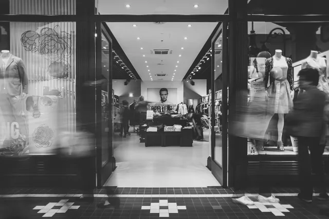 shopping, store, fashion, retail, ecommerce, clothing, entrance, people, city, urban, sidewalk, gray city, gray fashion, gray shopping, gray clothes, gray shop, retail, retail, retail, ecommerce, ecommerce, ecommerce, ecommerce, ecommerce. Shop the look modules: labels, returns and disclosure